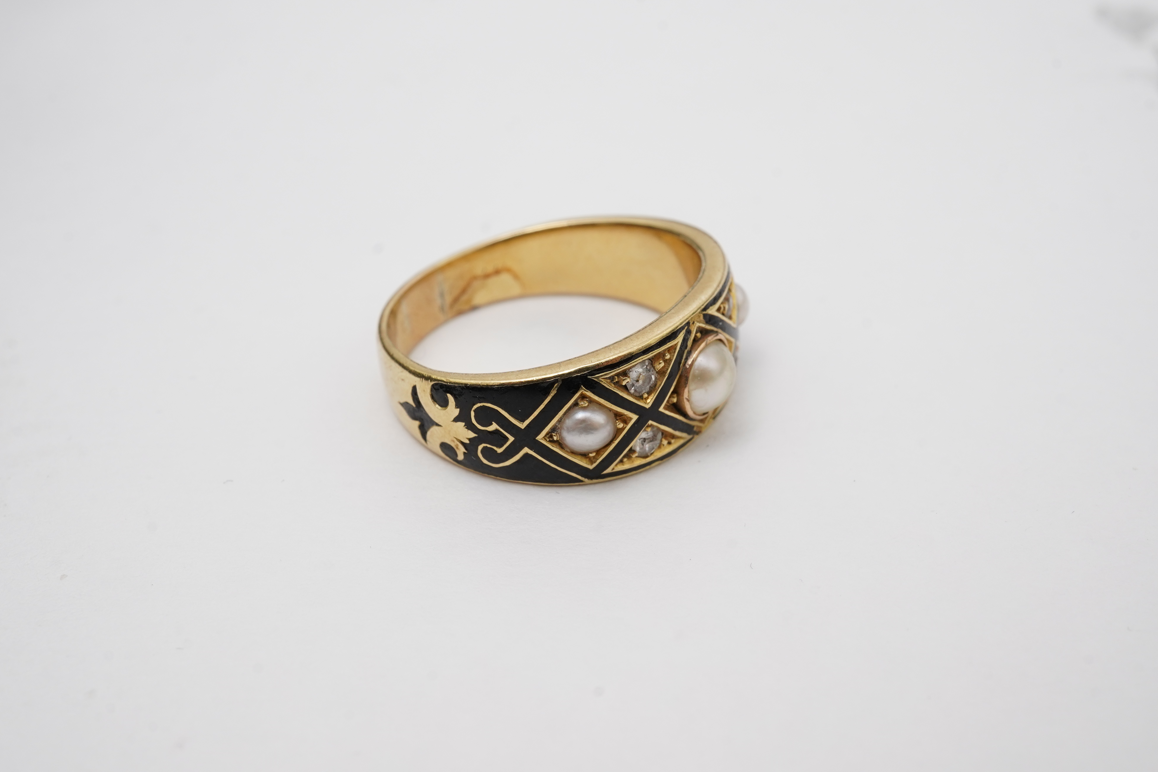 A Victorian pearl, enamel and diamond mourning ring, late 19th century